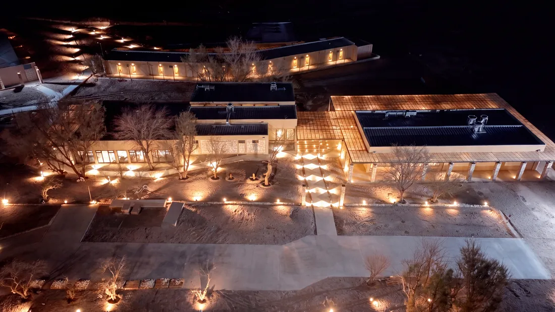 Tockolen at night seen from above, lit by fires and lanterns